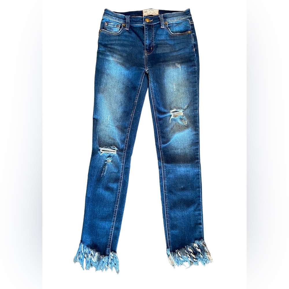 Free people high waisted dark washed  skinny jeans with raw hem. Size 25